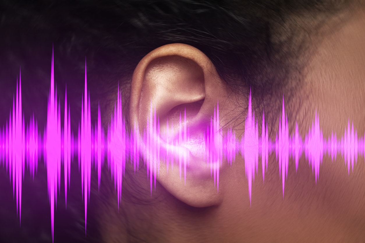Purple sound wave illustration of a woman's ear